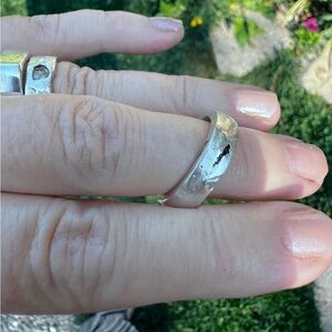 Sandcast sterling silver ring with hidden sapphire